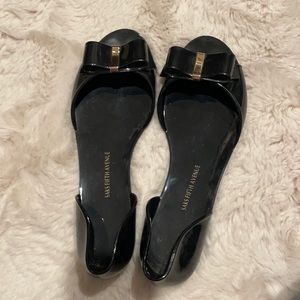 Jelly flats black and gold Saks fifth ave